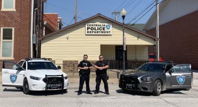 Officer Feger and School Resource Officer David Davenport in front of the Centralia Police Department